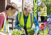 three graduate students volunteering