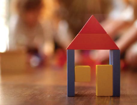 Image of a house built with toy bricks